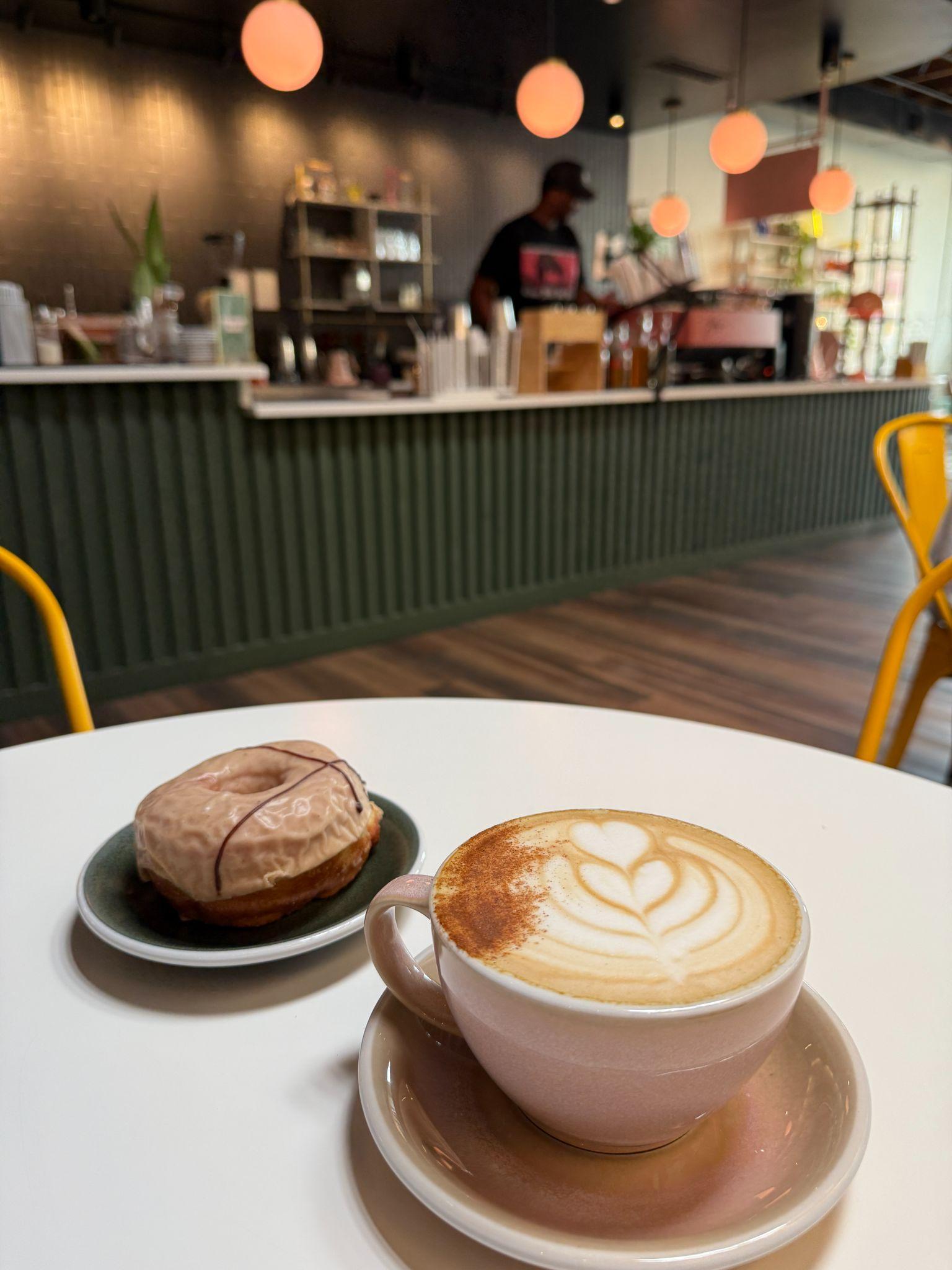 Interior of Parallax Coffee Lab in downtown Wendell, NC with retro-modern decor and craft coffee drinks