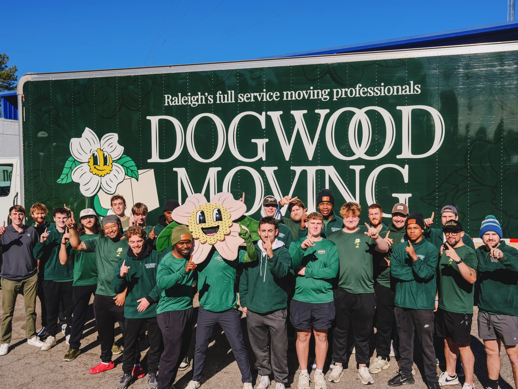 The Dogwood Moving team in front of a branded truck